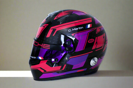 Black, pink, and purple Porsche racing helmet on a white background